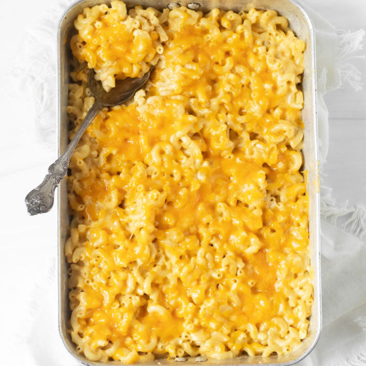 Gluten-Free Baked Macaroni and Cheese is the definition of comfort food and the perfect easy dinner recipe but also makes a delicious side dish. We love making this easy mac n cheese recipe as a holiday side dish recipe. It is a great Thanksgiving side dish, Easter side dish, and summer cook out recipe. Our three-cheese macaroni and cheese is great to make year-round making it a staple gluten-free recipe. You can make this easy pasta dish as a quick weeknight dinner and it is also a great kid-friendly dinner recipe.
