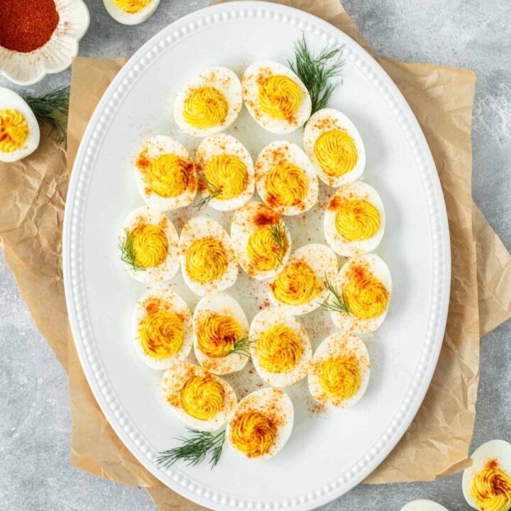 These Instant Pot Deviled Eggs are a simple and quick appetizer recipe made with hard boiled eggs filled with a spicy and saucy egg yolk filling. We love serving this recipe as a healthy appetizer or easy snack.