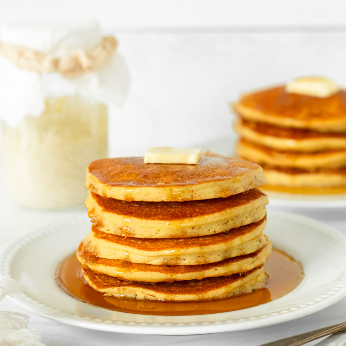 These gluten-free sourdough pancakes are an easy gluten-free sourdough recipe made with simple ingredients and sourdough discard. This is a quick breakfast recipe perfect for both a weekday and weekend breakfast.