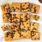 These chocolate chip cookie bars are soft and chewy homemade cookie bars filled with chocolate chips and perfect for making as a weekend treat or to share at a party or potluck.