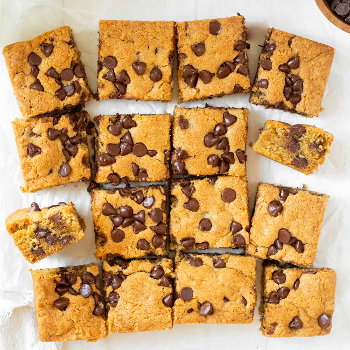 These chocolate chip cookie bars are soft and chewy homemade cookie bars filled with chocolate chips and perfect for making as a weekend treat or to share at a party or potluck.
