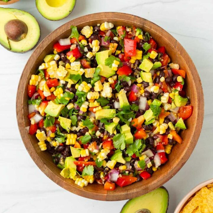 This cowboy caviar salsa is an easy gluten-free appetizer made with fresh vegetables and loaded with flavor. This homemade salsa is the perfect summer barbecue appetizer and a great Fourth of July appetizer.