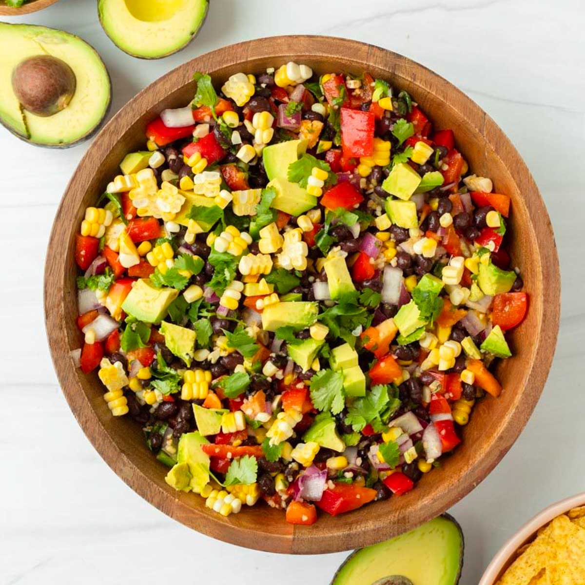This cowboy caviar salsa is an easy gluten-free appetizer made with fresh vegetables and loaded with flavor. This homemade salsa is the perfect summer barbecue appetizer and a great Fourth of July appetizer.