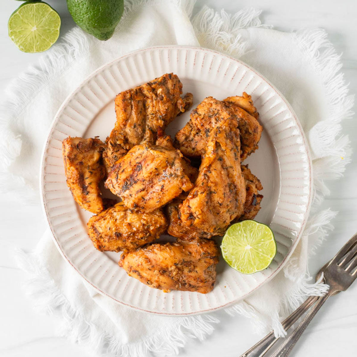 This grilled jerk chicken recipe is a delicious summer grilling recipe made with a fresh and homemade jerk marinade perfect for a summer cookout or Fourth of July party.