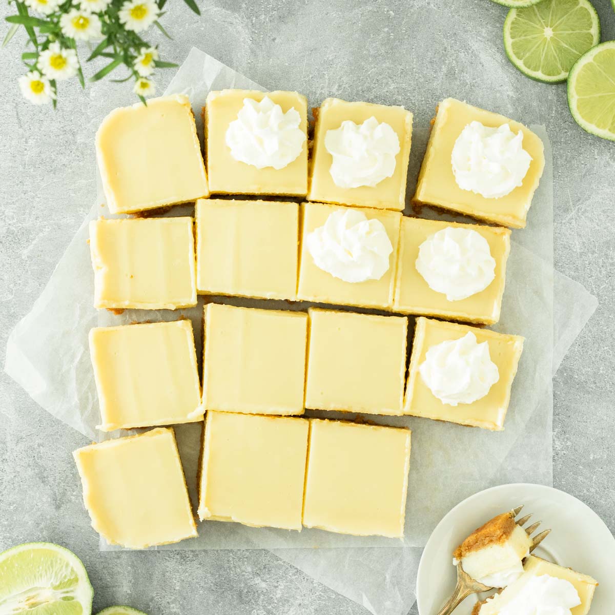 These key lime pie bars are a delicious spring and summer dessert made with a simple homemade crust and topped with a 3-ingredient key lime topping. This dessert bar recipe is perfect to serve at a holiday, party and great for a Fourth of July dessert.