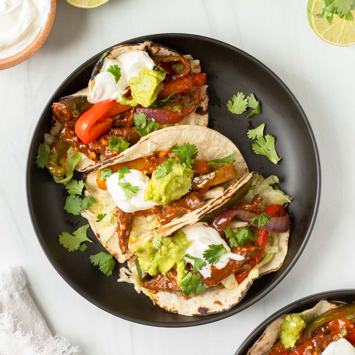 These steak fajitas are an easy one-pan recipe made with steak and vegetables cooked in a homemade fajita marinade for excellent flavor. This recipe is the perfect weeknight dinner and a kid-friendly meal.