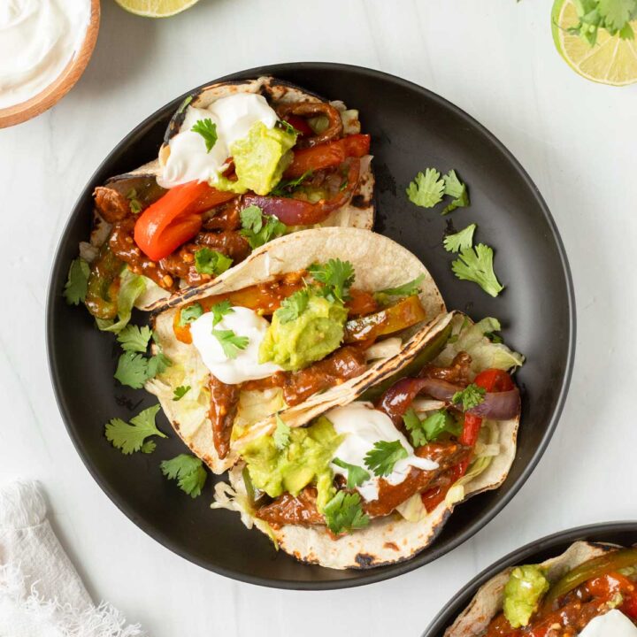 These steak fajitas are an easy one-pan recipe made with steak and vegetables cooked in a homemade fajita marinade for excellent flavor. This recipe is the perfect weeknight dinner and a kid-friendly meal.