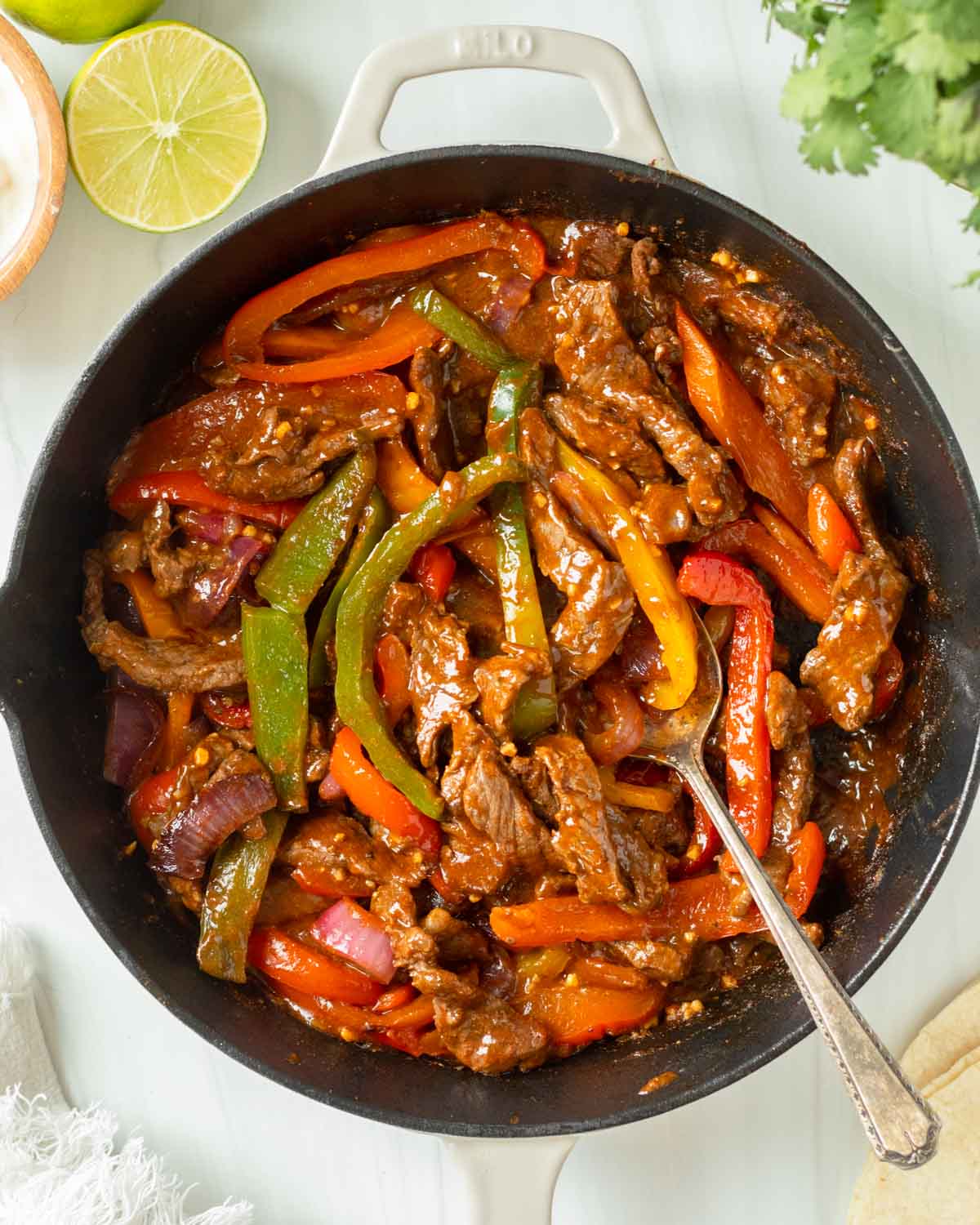 These steak fajitas are an easy one-pan recipe made with steak and vegetables cooked in a homemade fajita marinade for excellent flavor. This recipe is the perfect weeknight dinner and a kid-friendly meal.