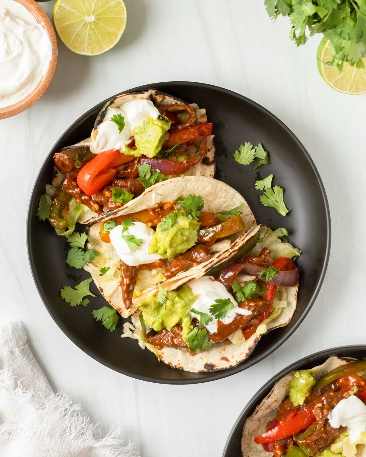 These steak fajitas are an easy one-pan recipe made with steak and vegetables cooked in a homemade fajita marinade for excellent flavor. This recipe is the perfect weeknight dinner and a kid-friendly meal.