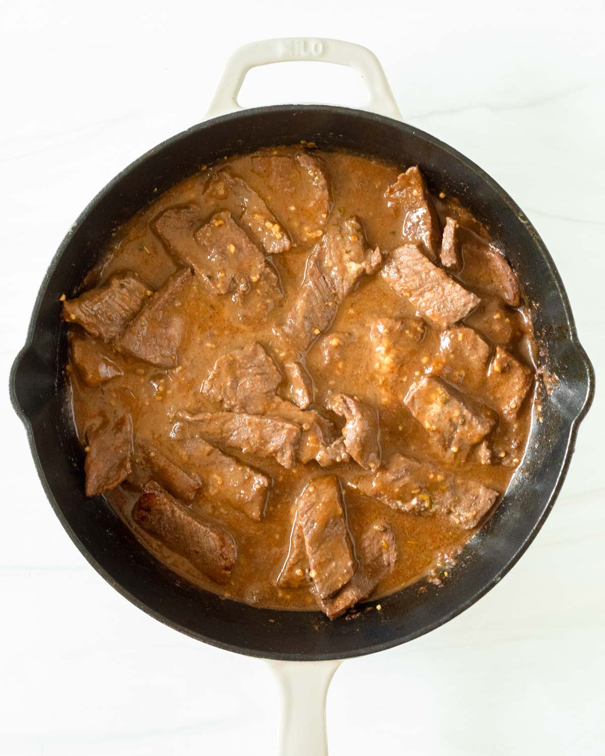 Step 5. Pour the fajita sauce into the skillet to coat the steak