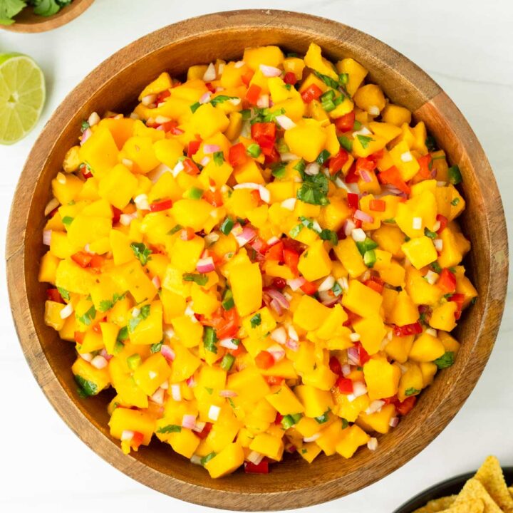 This mango salsa is an easy 6-ingredient salsa recipe perfect for a summer cookout or as a Fourth of July appetizer. Made with simple, flavorful ingredients, this homemade salsa is an easy and delicious summer dish.