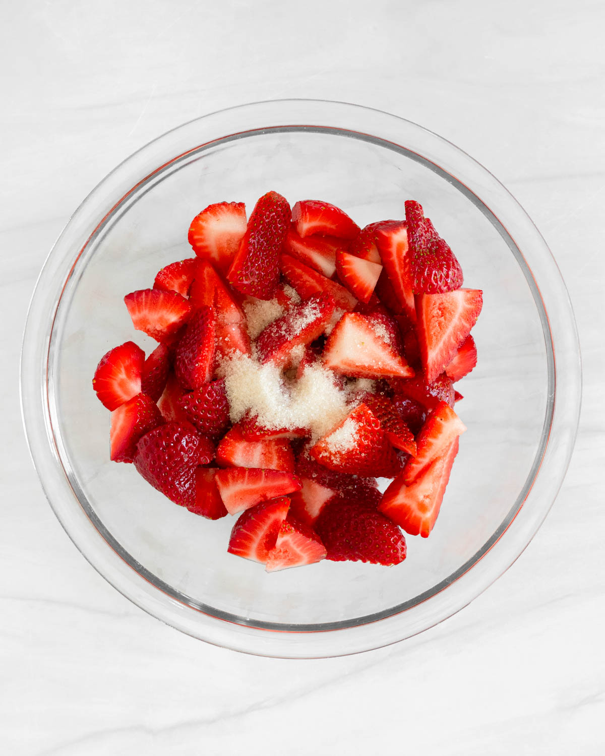 Step 1. Add the strawberries and 1 TBS sugar to a small bowl