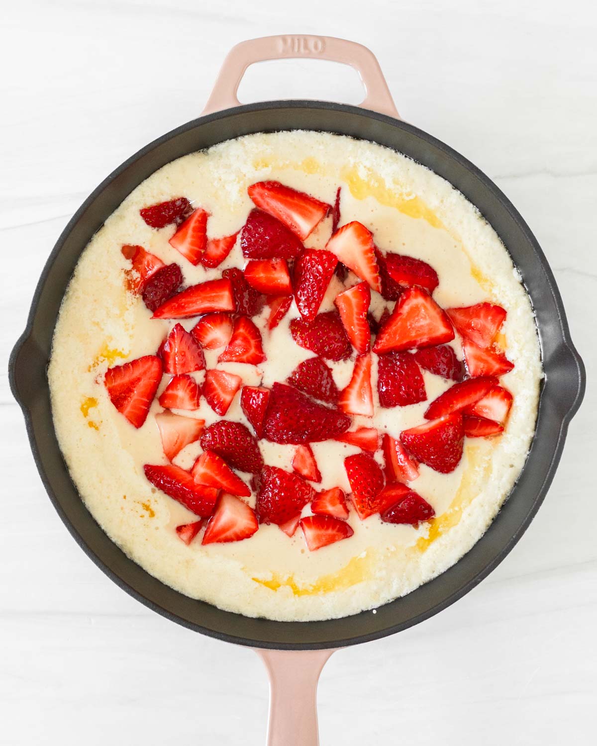 Step 9. Scoop the berries into the skillet with the batter and butter