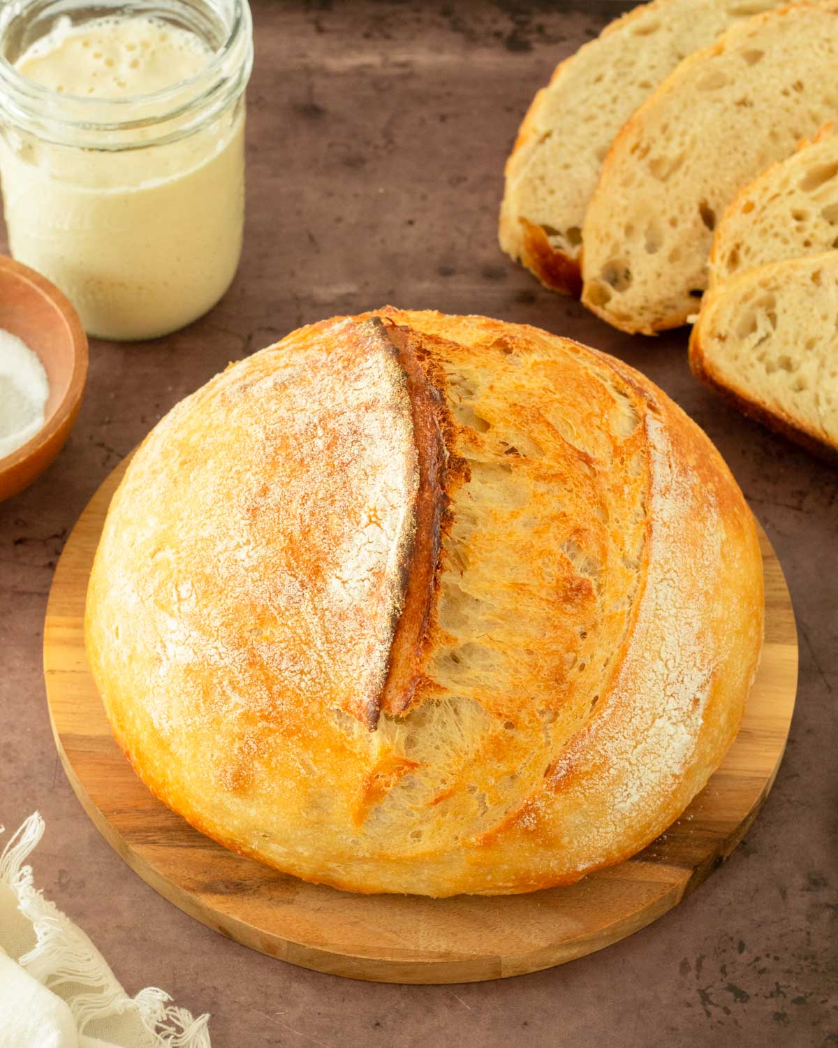 This guide to how to make sourdough bread is an easy-to-follow step-by-step guide to making classic sourdough bread from scratch. This recipe calls for 4 simple ingredients to make delicious, homemade bread.