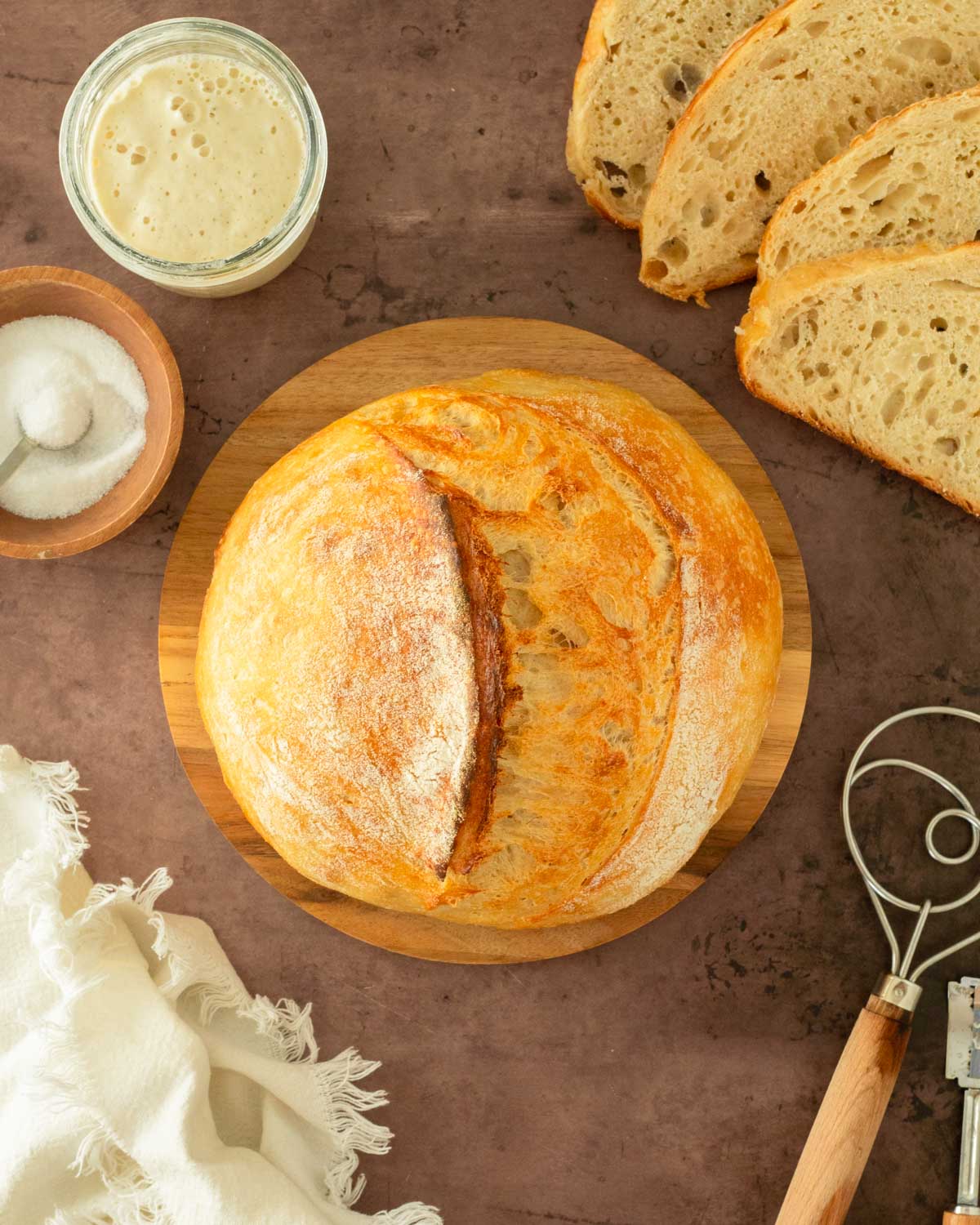 This guide to how to make sourdough bread is an easy-to-follow step-by-step guide to making classic sourdough bread from scratch. This recipe calls for 4 simple ingredients to make delicious, homemade bread.