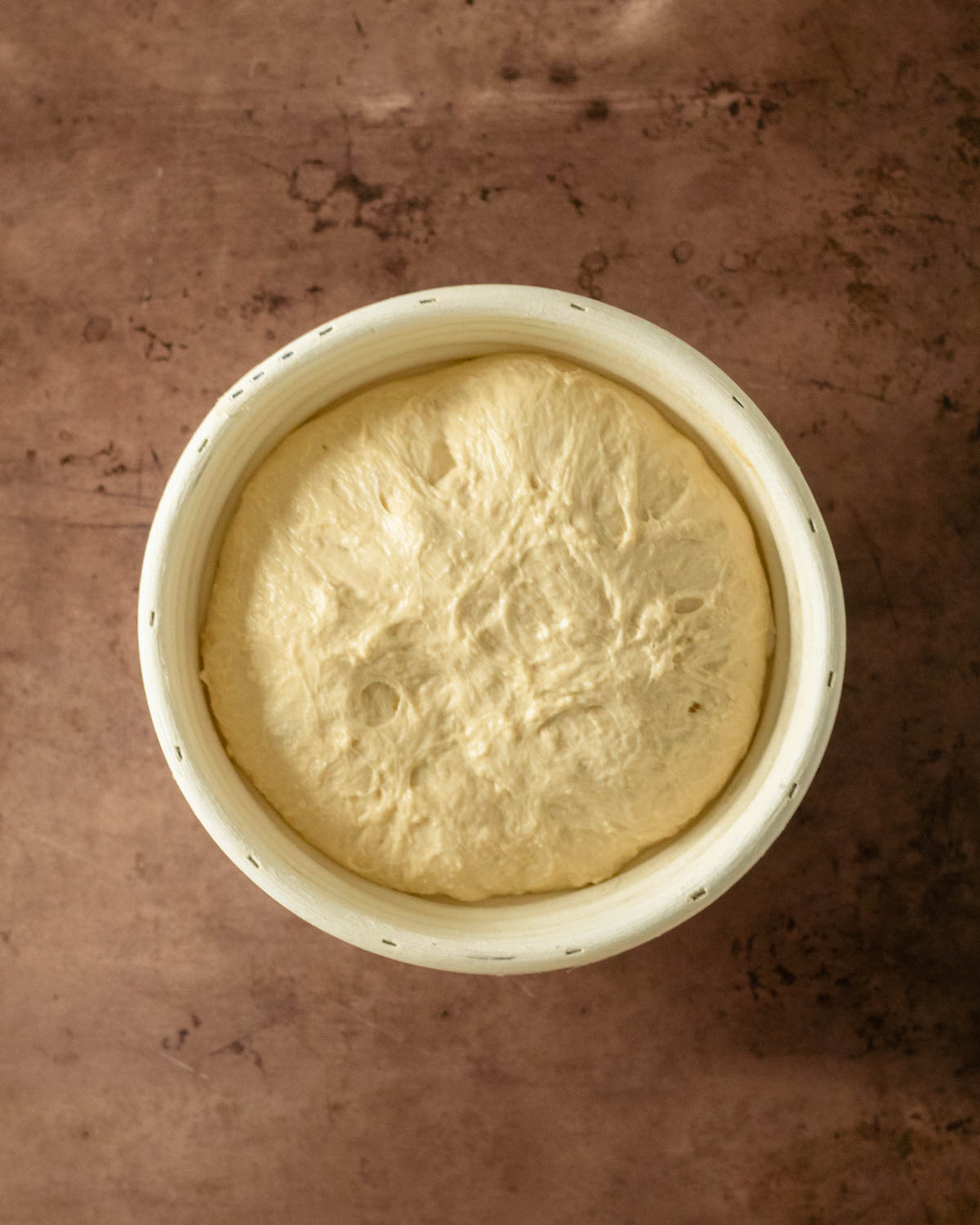 Step 16. Flip the dough into a proofing basket to proof in the fridge