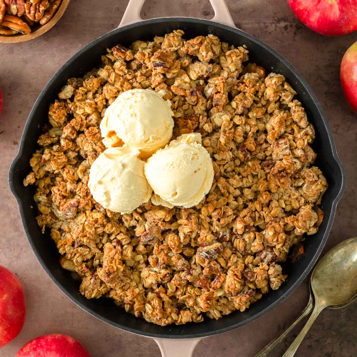 This skillet apple crisp is a classic fall dessert made with freshly picked apples tossed in maple syrup and cinnamon and baked in a skillet with a flavorful crisp topping.