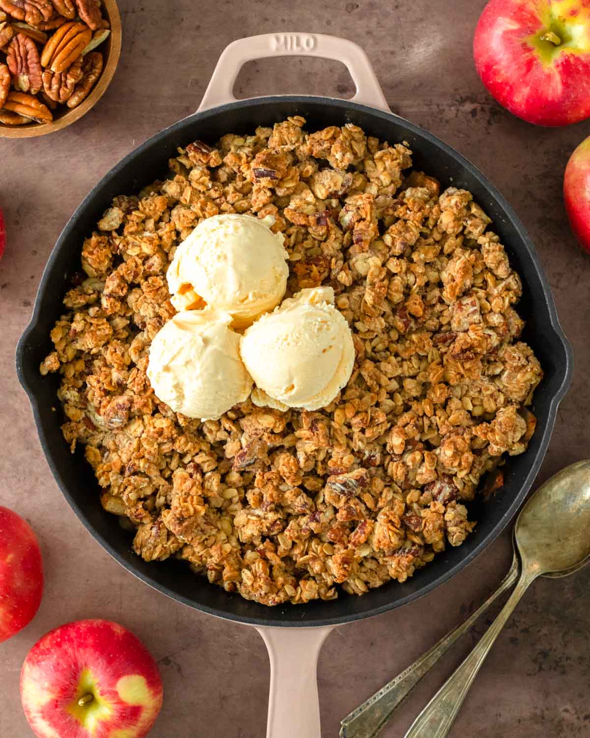 This skillet apple crisp is a classic fall dessert made with freshly picked apples tossed in maple syrup and cinnamon and baked in a skillet with a flavorful crisp topping.