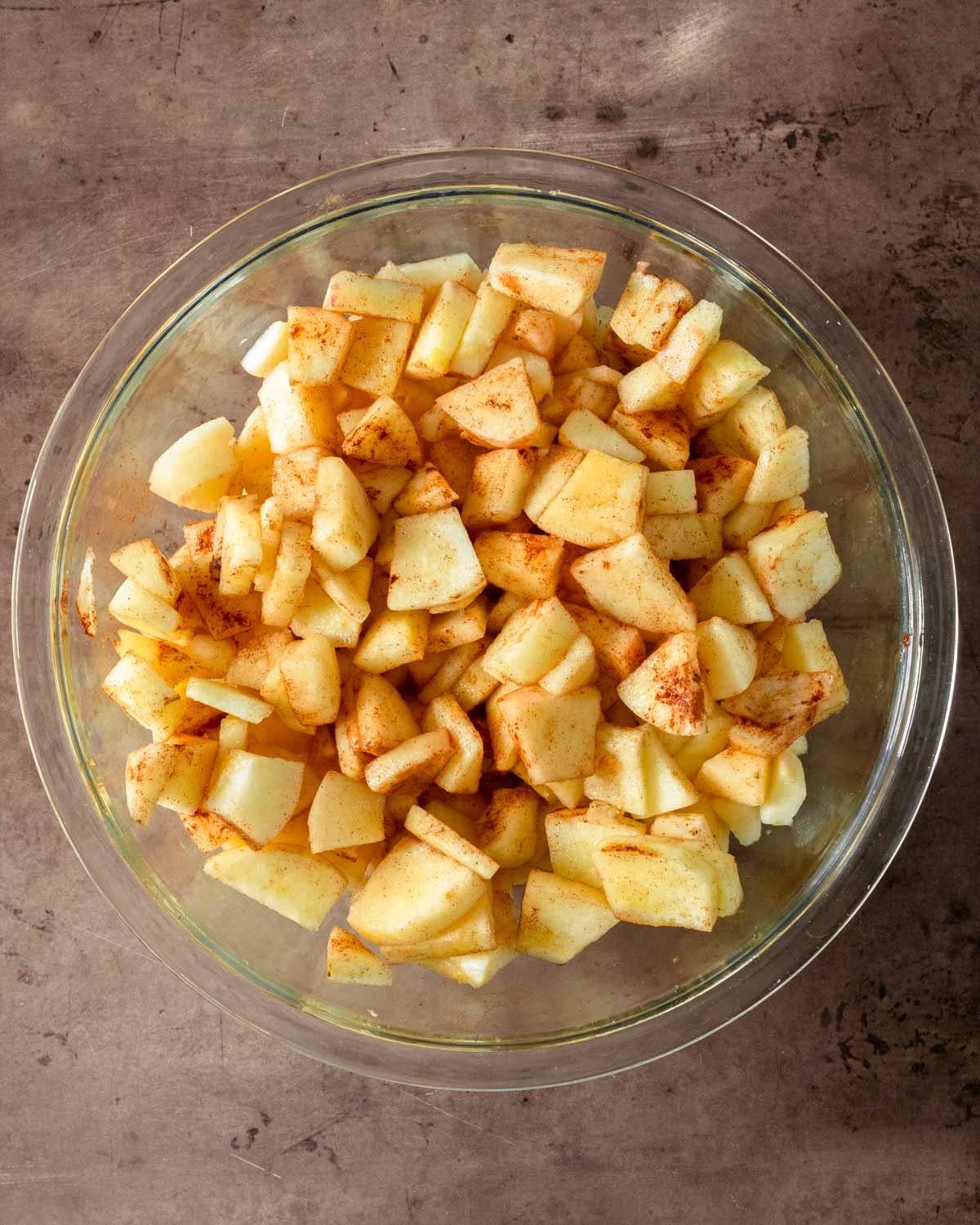 Step 1. Peel, core and slice the apples & mix with the water, maple syrup and cinnamon to the bowl