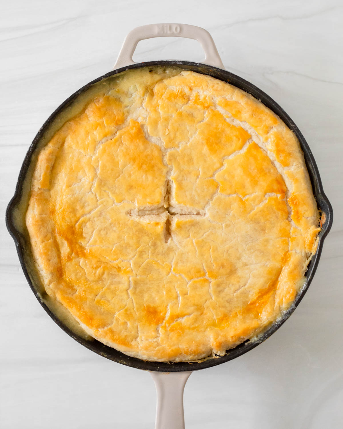 Step 4. Place the pie crust on top of the skillet and bake in the oven