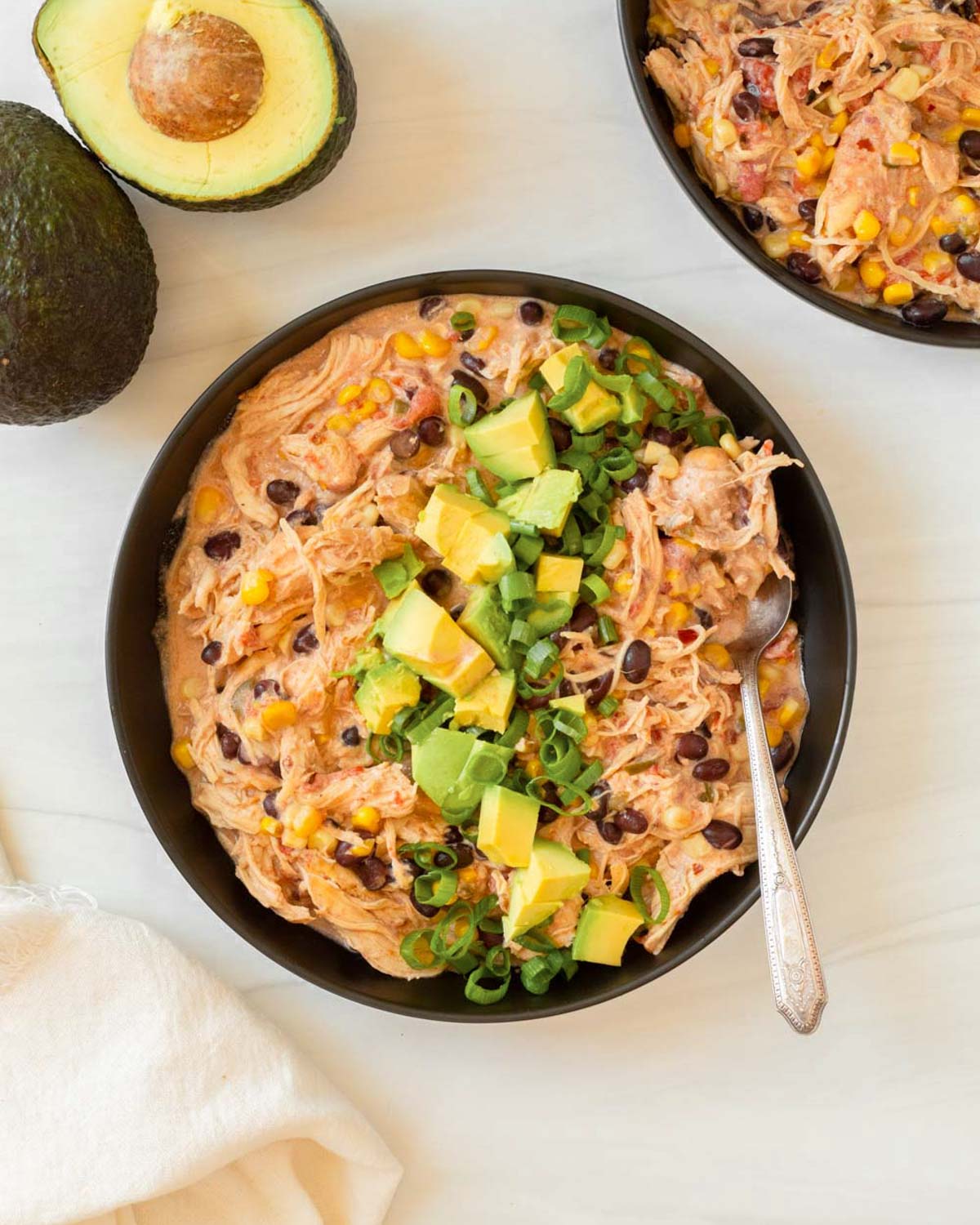 This crockpot cream cheese chicken chili is an easy dump and go crockpot recipe made with simple ingredients for a flavorful and filling comfort food meal.