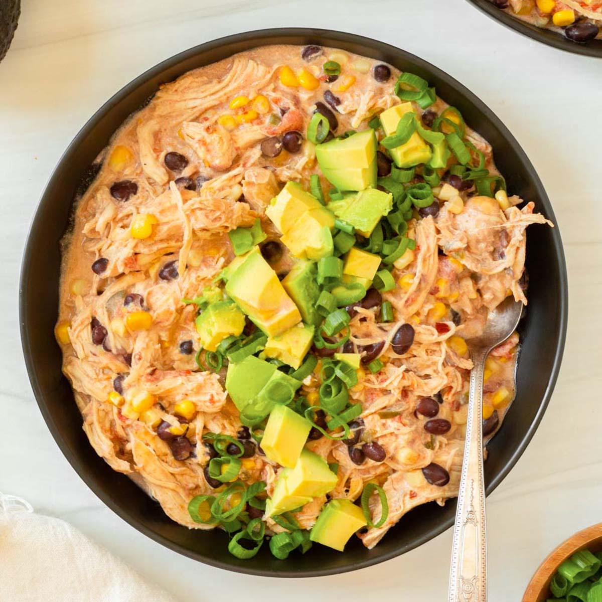 This crockpot cream cheese chicken chili is an easy dump and go crockpot recipe made with simple ingredients for a flavorful and filling comfort food meal.
