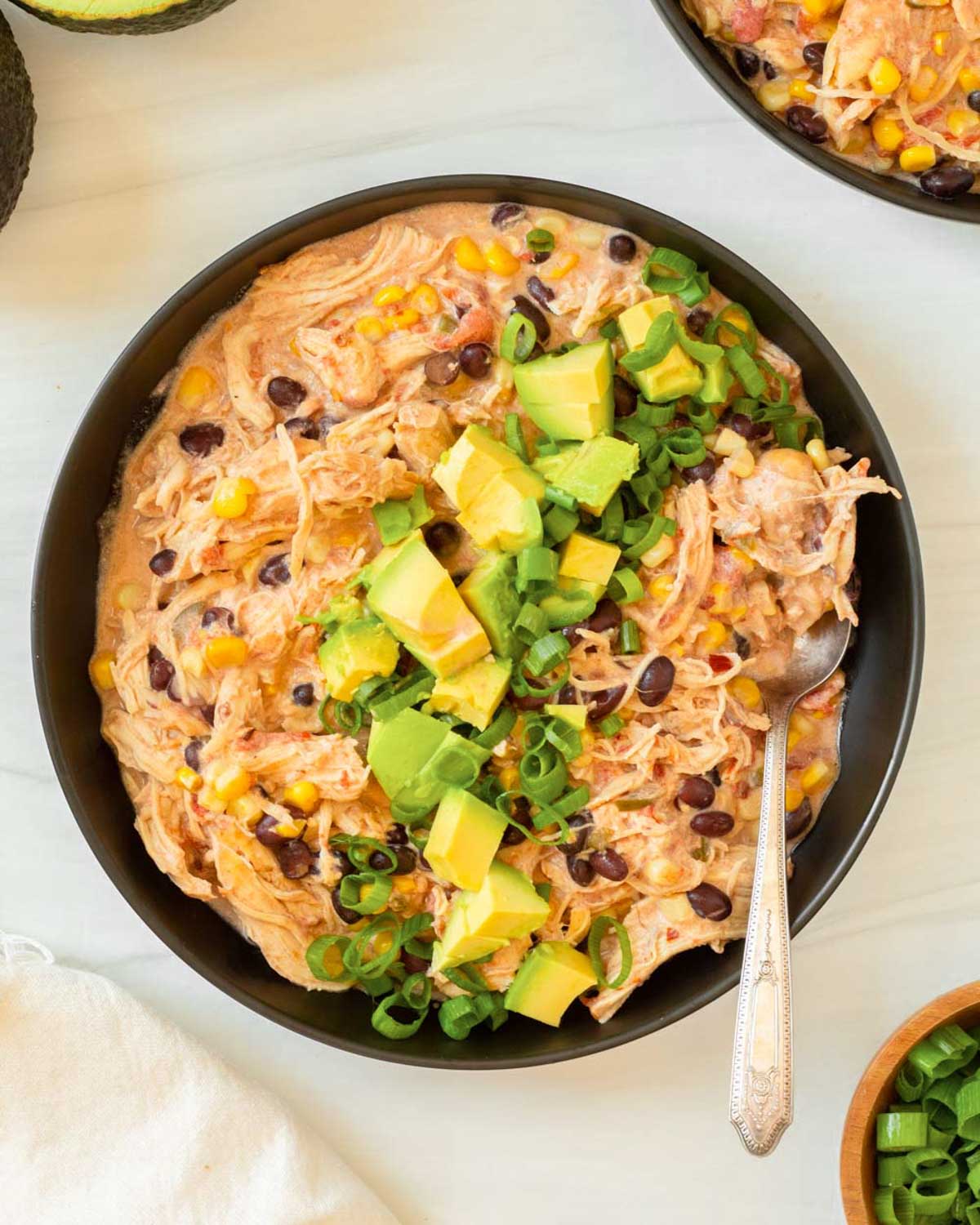 This crockpot cream cheese chicken chili is an easy dump and go crockpot recipe made with simple ingredients for a flavorful and filling comfort food meal.