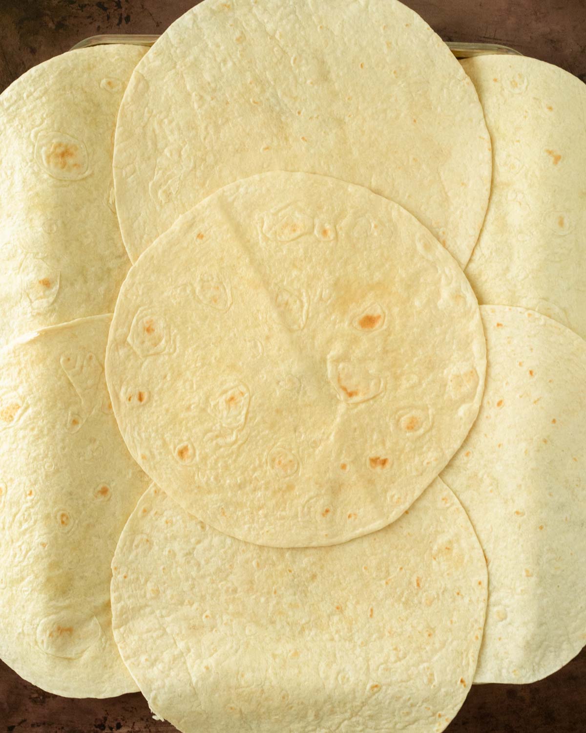 Step 5. Arrange the tortillas on the sheet pan