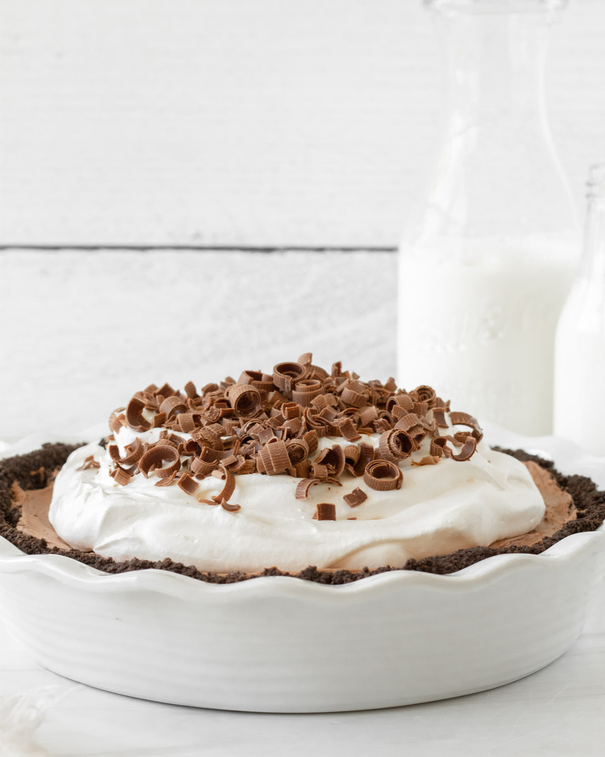 This French Silk Pie is a decadent chocolate pie recipe made with a chocolate crust, rich chocolate mousse filling and whipped cream topping. This homemade pie is our favorite holiday dessert recipe for Thanksgiving and Christmas.