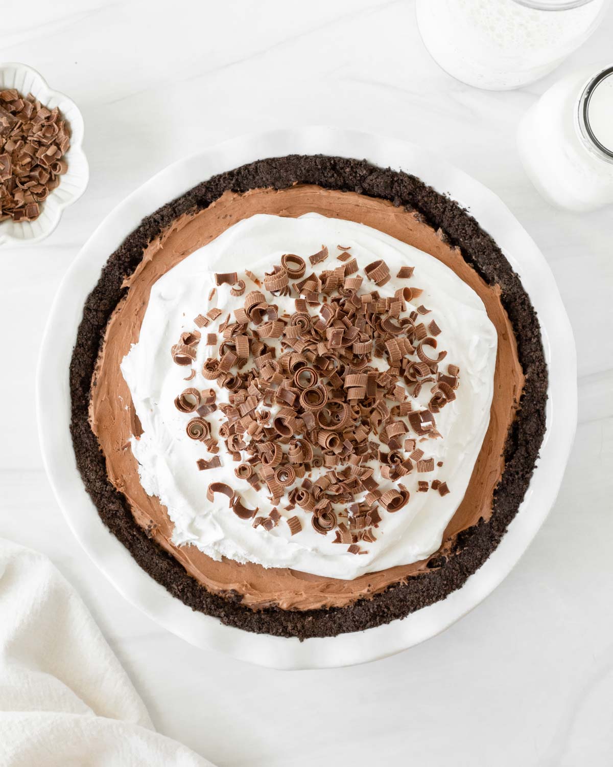 This French Silk Pie is a decadent chocolate pie recipe made with a chocolate crust, rich chocolate mousse filling and whipped cream topping. This homemade pie is our favorite holiday dessert recipe for Thanksgiving and Christmas.