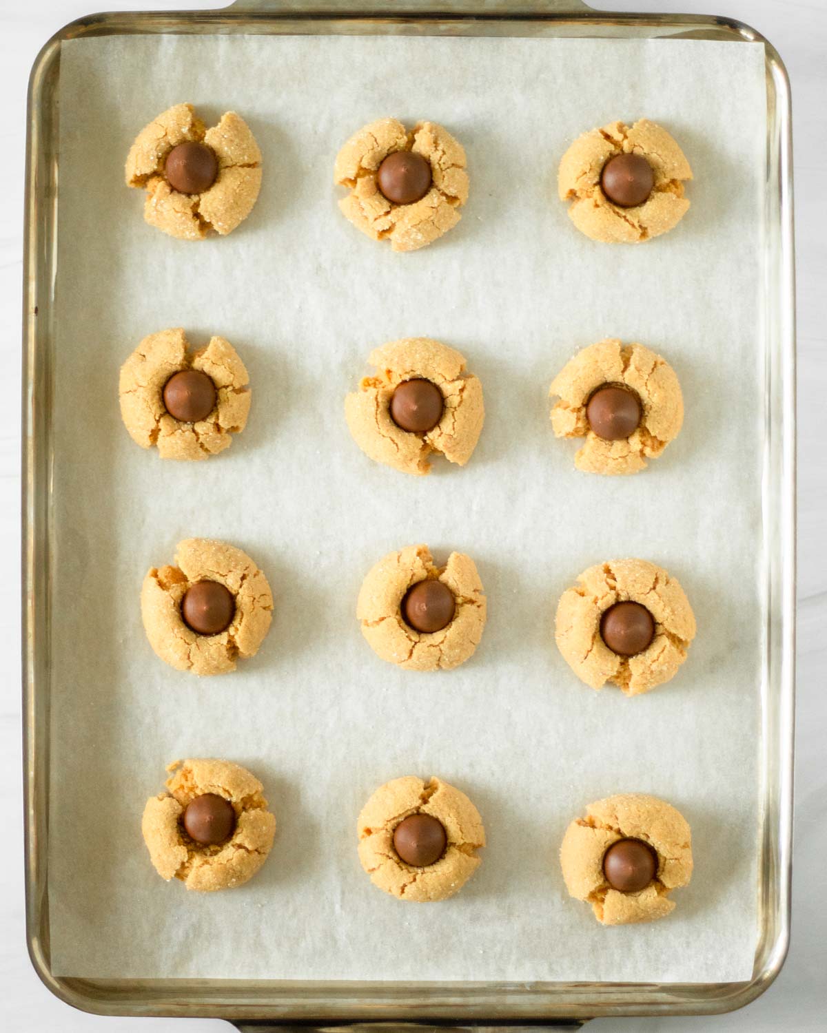 Step 4. Bake the cookies and press the kisses into each cookie