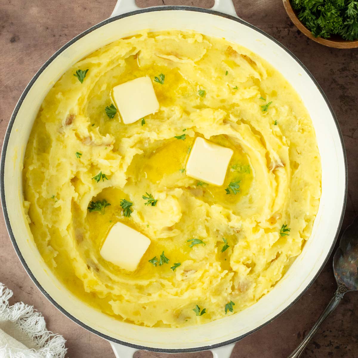 These classic mashed potatoes are a simple, flavorful mashed potato recipe that uses Yukon gold potatoes for the perfect, easy side dish for a weeknight dinner or holiday meal.