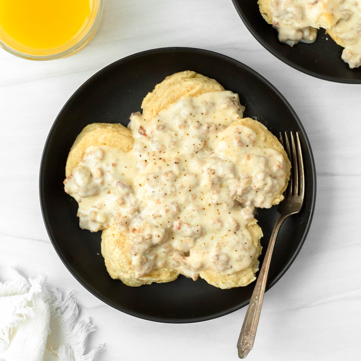This biscuits and gravy recipe is a classic comfort food breakfast recipe made with a thick sausage gravy served over flaky buttery biscuits.
