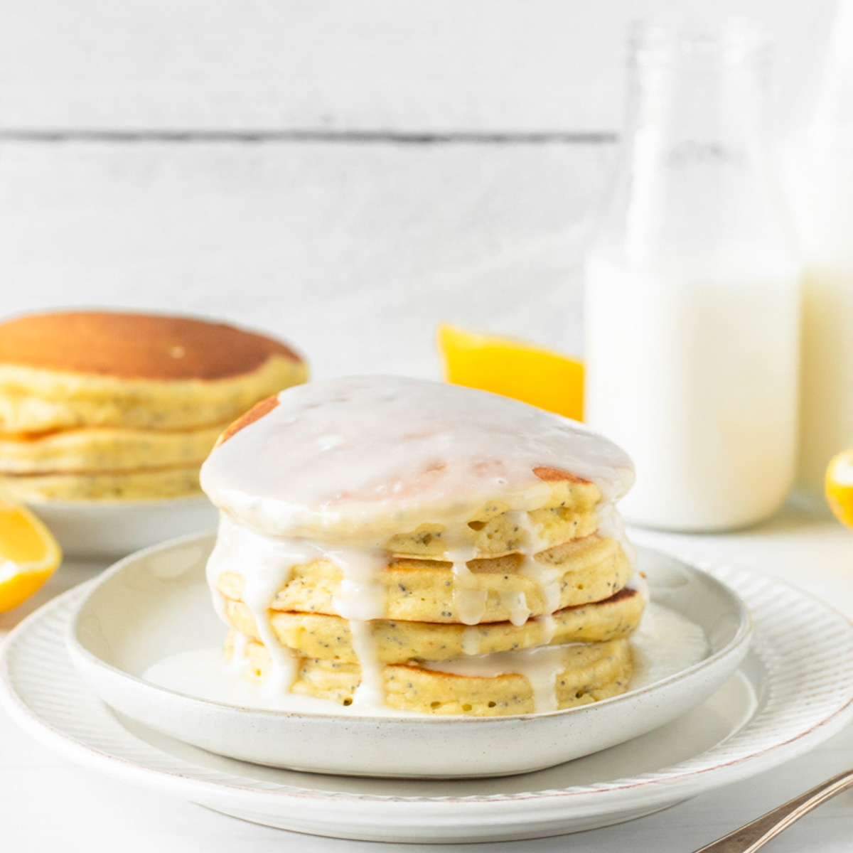 These lemon poppy seed pancakes are a fluffy, classic pancake filled with fresh lemon juice and poppy seeds for a delicious spring breakfast.