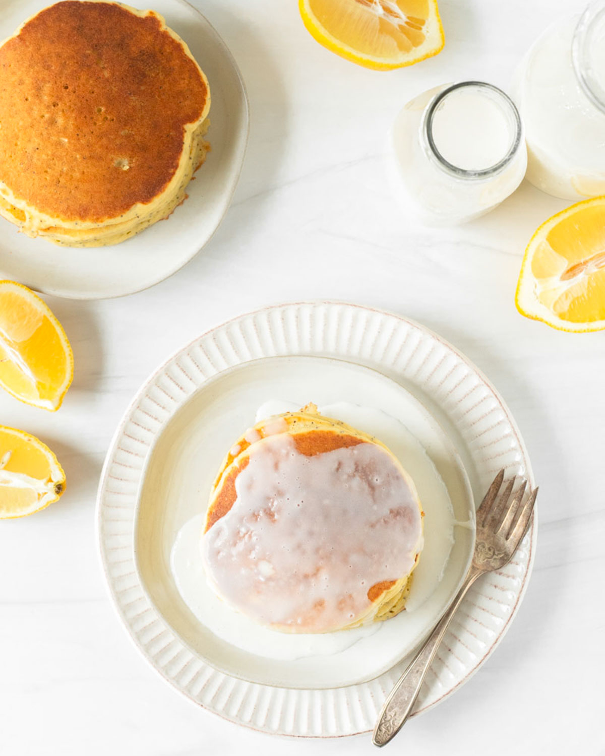 These lemon poppy seed pancakes are a fluffy, classic pancake filled with fresh lemon juice and poppy seeds for a delicious spring breakfast.
