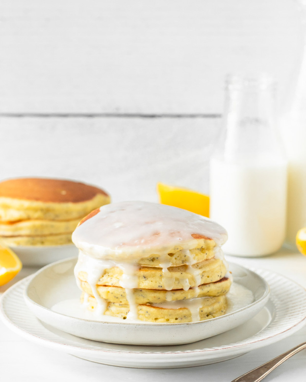 These lemon poppy seed pancakes are a fluffy, classic pancake filled with fresh lemon juice and poppy seeds for a delicious spring breakfast.