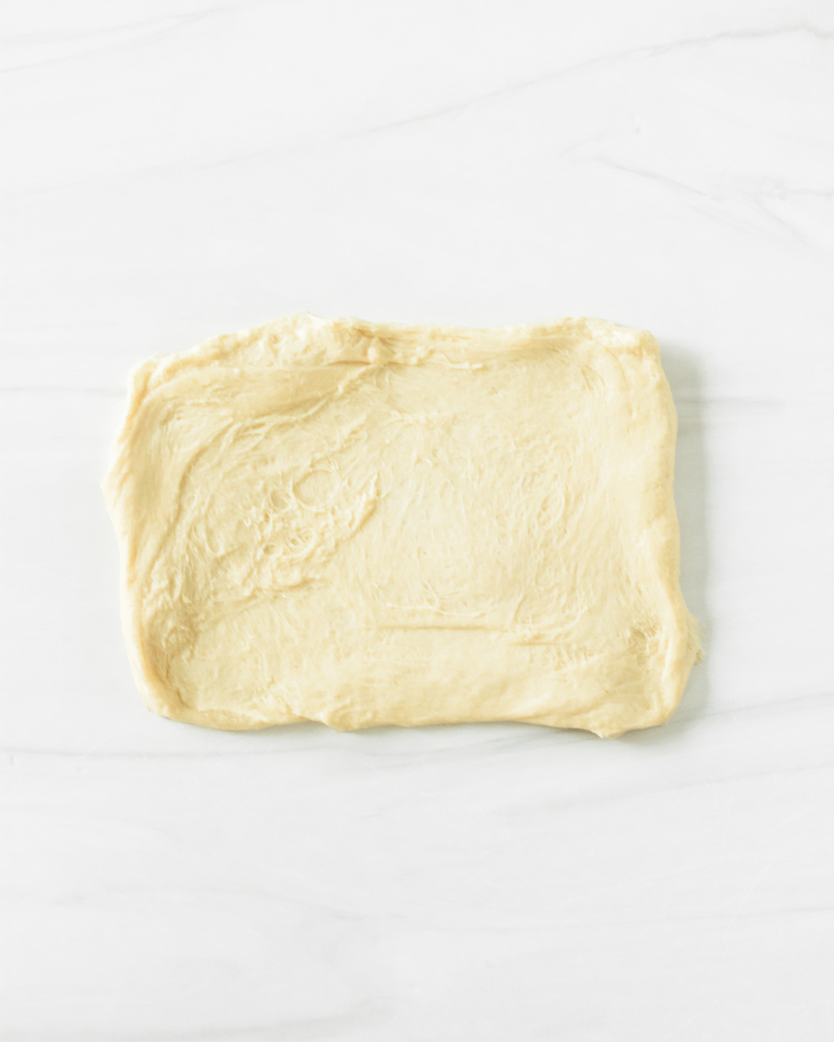 Step 3. Stretch each section of dough into a rectangle