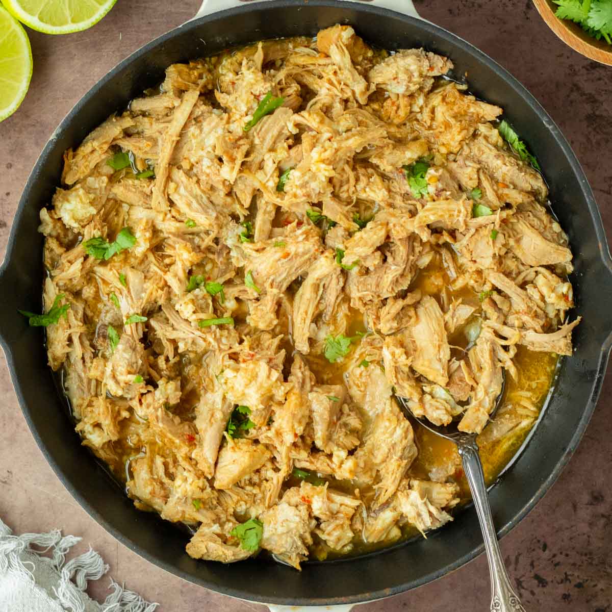 These crockpot pork carnitas are a flavorful and easy crockpot recipe made with pork loin generously seasoned and slow cooked in fresh orange and lime juice to make a flavorful shredded meat perfect for tacos, enchiladas and more.