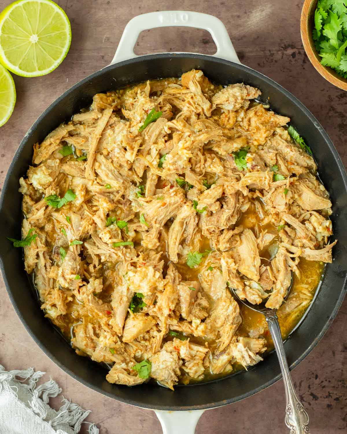 These crockpot pork carnitas are a flavorful and easy crockpot recipe made with pork loin generously seasoned and slow cooked in fresh orange and lime juice to make a flavorful shredded meat perfect for tacos, enchiladas and more.