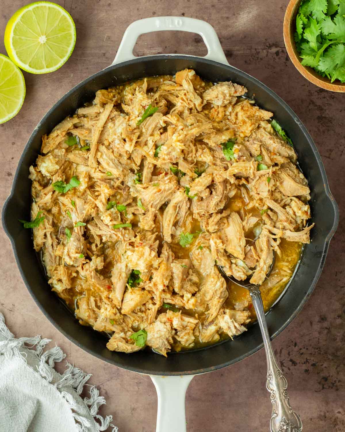 These crockpot pork carnitas are a flavorful and easy crockpot recipe made with pork loin generously seasoned and slow cooked in fresh orange and lime juice to make a flavorful shredded meat perfect for tacos, enchiladas and more.