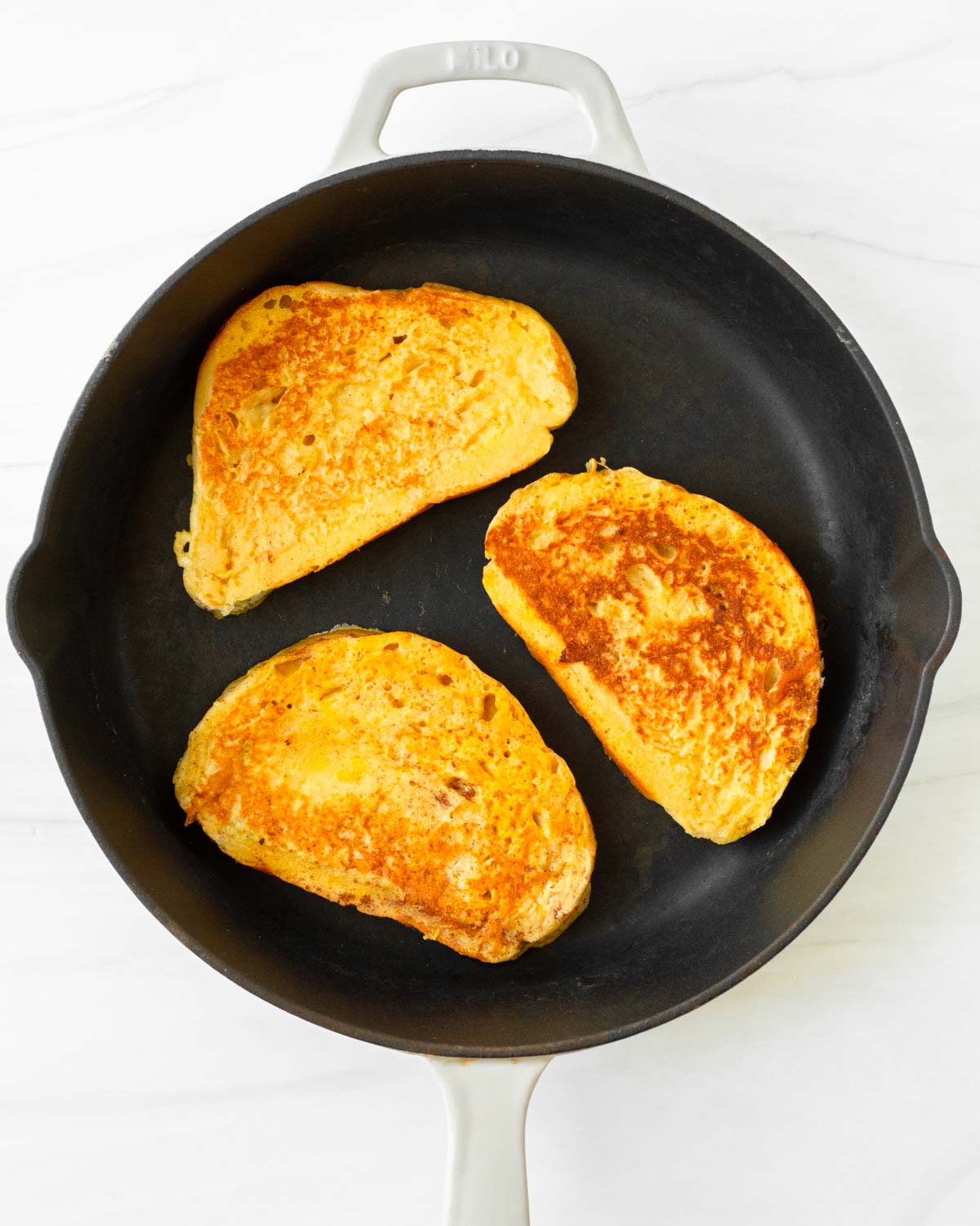 Step 3. Cook each piece of toast in a skillet or on a griddle