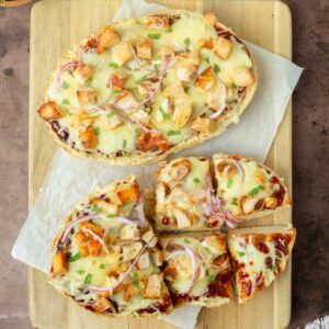 This BBQ chicken French bread pizza is an easy homemade pizza recipe made with homemade French bread topped with classic pizza toppings for a quick and delicious dinner recipe.