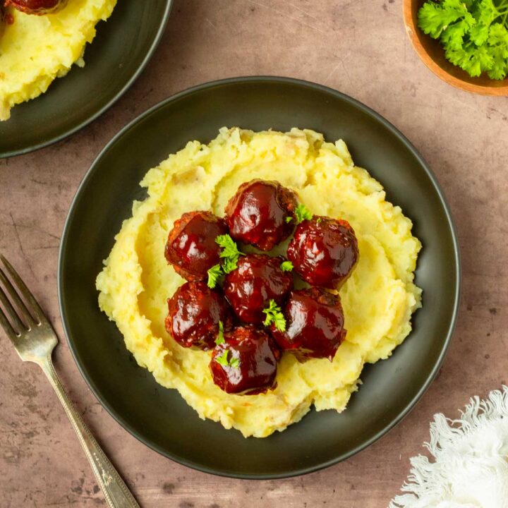 These BBQ meatloaf meatballs are a quick and easy dinner recipe made with classic meatloaf ingredients for flavorful, juicy meatballs topped with a barbeque sauce glaze.