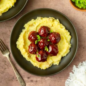 These BBQ meatloaf meatballs are a quick and easy dinner recipe made with classic meatloaf ingredients for flavorful, juicy meatballs topped with a barbeque sauce glaze.