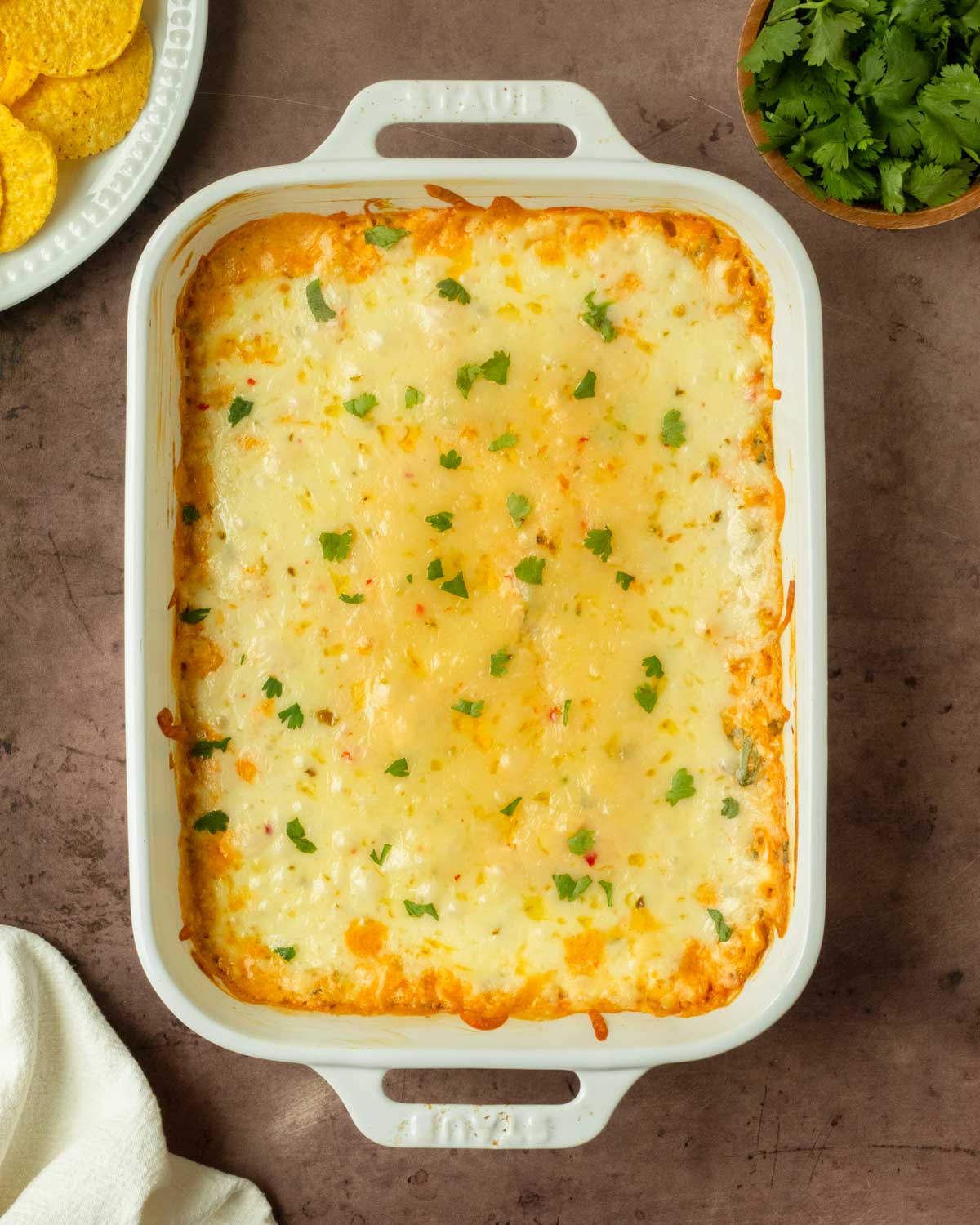 This cheesy corn dip is a quick, easy and flavorful dip recipe made with simple ingredients including corn, cheese, sour cream, mayonnaise, and spices perfect for a crowd-pleaser appetizer.