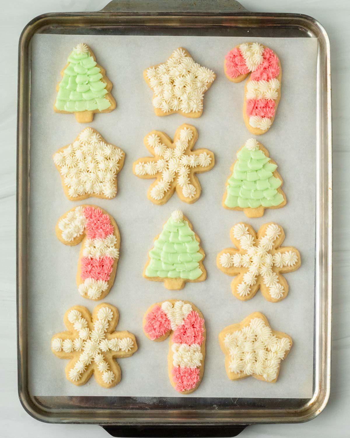 These cut-out sugar cookies are thick and soft homemade sugar cookies made with simple ingredients and perfect to customize for any holiday including Christmas, Easter, birthdays, baby showers and more!
