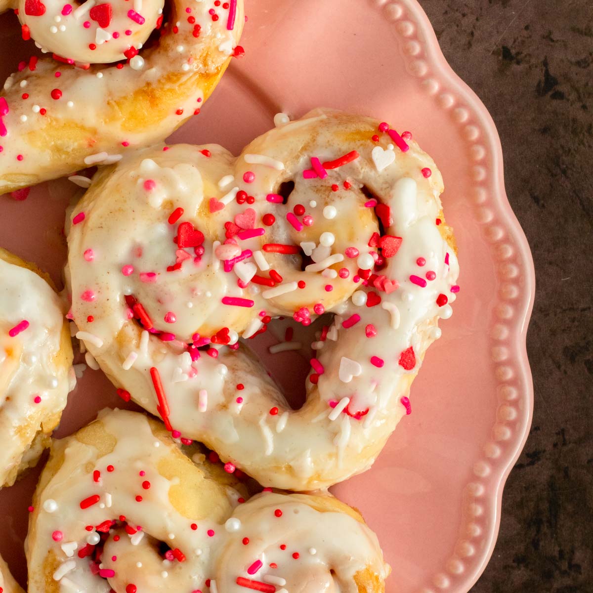 These heart shaped cinnamon rolls are the best classic soft, fluffy cinnamon rolls with a gooey cinnamon sugar filling and the perfect easy and delicious homemade Valentine's day treat.
