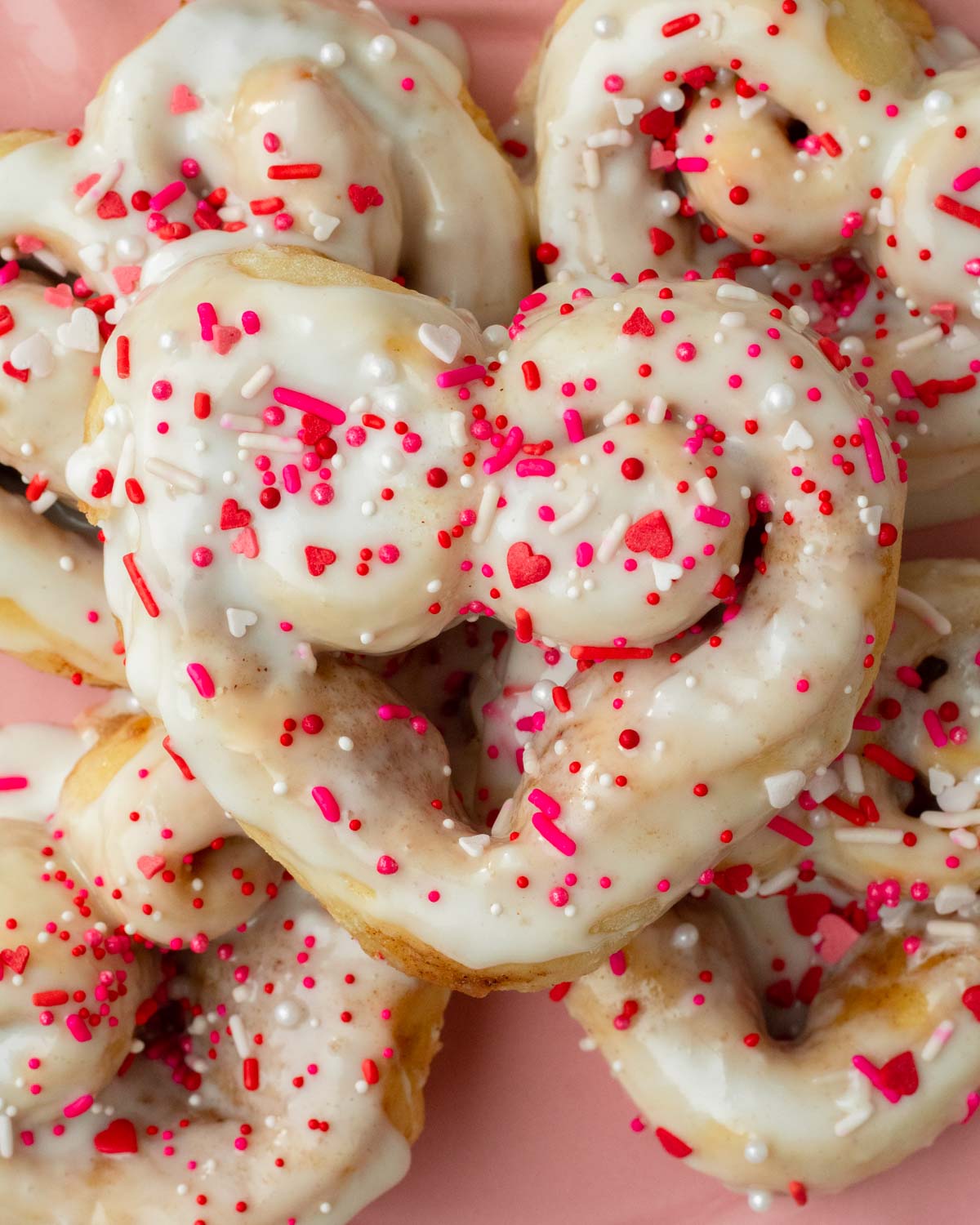 These heart shaped cinnamon rolls are the best classic soft, fluffy cinnamon rolls with a gooey cinnamon sugar filling and the perfect easy and delicious homemade Valentine's day treat.