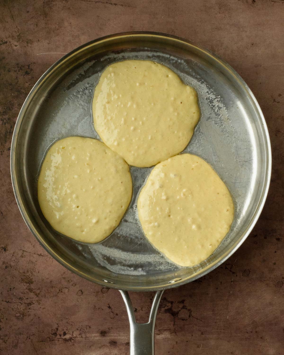 Step 2. Pour the batter into a preheated and buttered pan