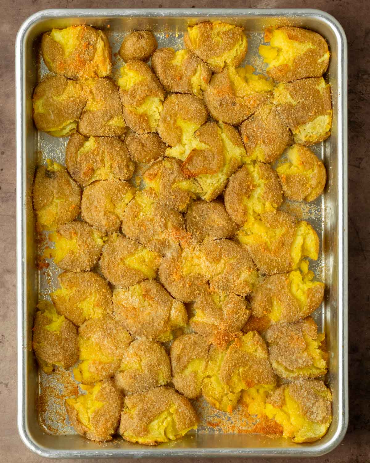 Step 2. Top with melted butter, oil and spice, then bake the potatoes in the oven.